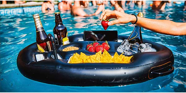 The Dive Blast inflatable tray filled with mobile phone, food and drinks