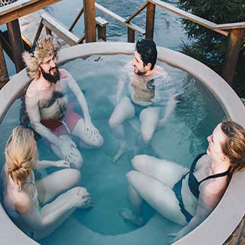People enjoying an outside hot tub